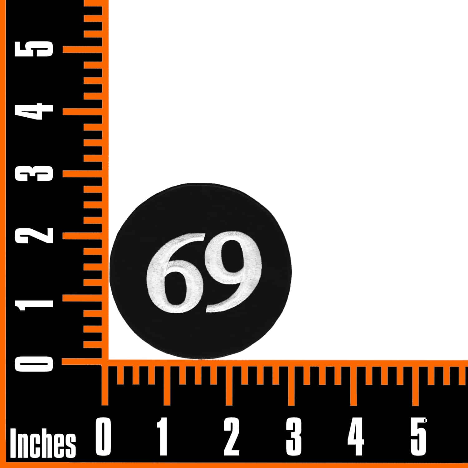 A ruler with the 69 Embroidered Iron On Patch - 3" Round on it.
