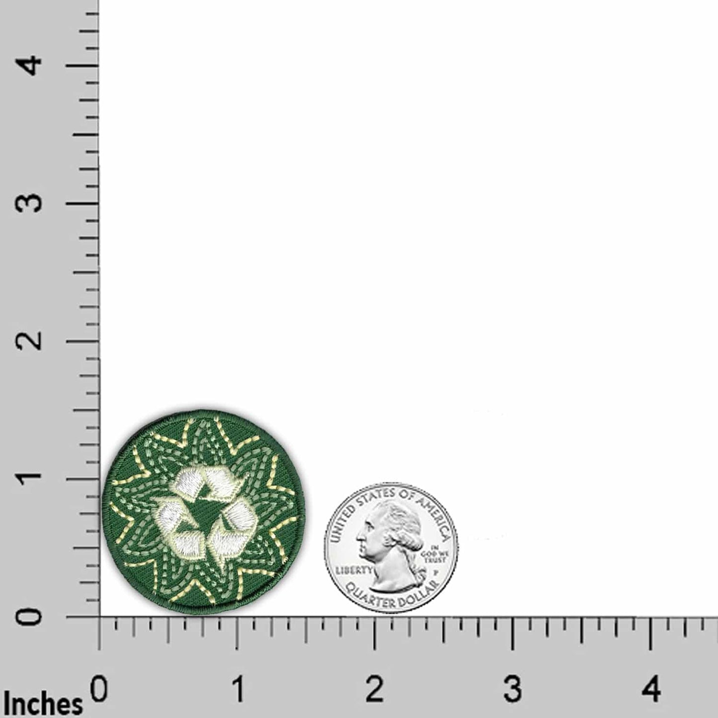 The Laughing Lizards Recycling Round (3-Pack) Ecology Iron On Patch features eco-friendly embroidery with a white recycling symbol, shown beside a U.S. quarter for scale on an inch-marked grid.