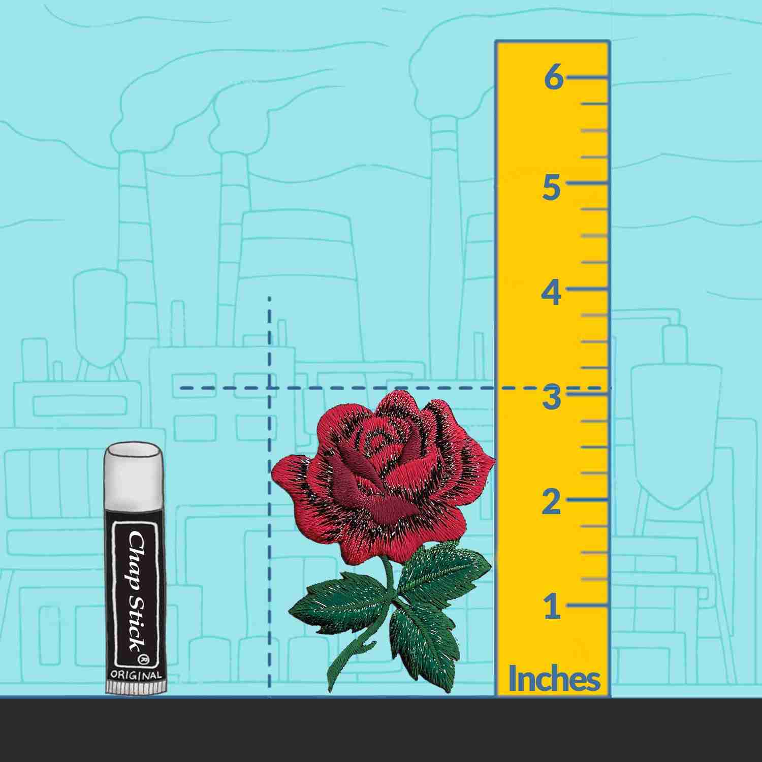 A Red Rose with Stem Floral Iron On Patch with Sparkling Thread next to a ruler and a bottle of lip balm.