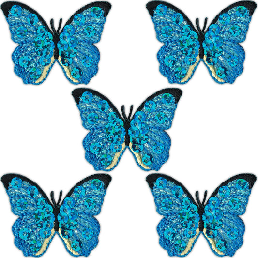 Five blue sequined butterfly insect patches from Laughing Lizards, sold as a 5-pack, feature vibrant embroidery and iron-on backing, perfect for decorating clothing or accessories.