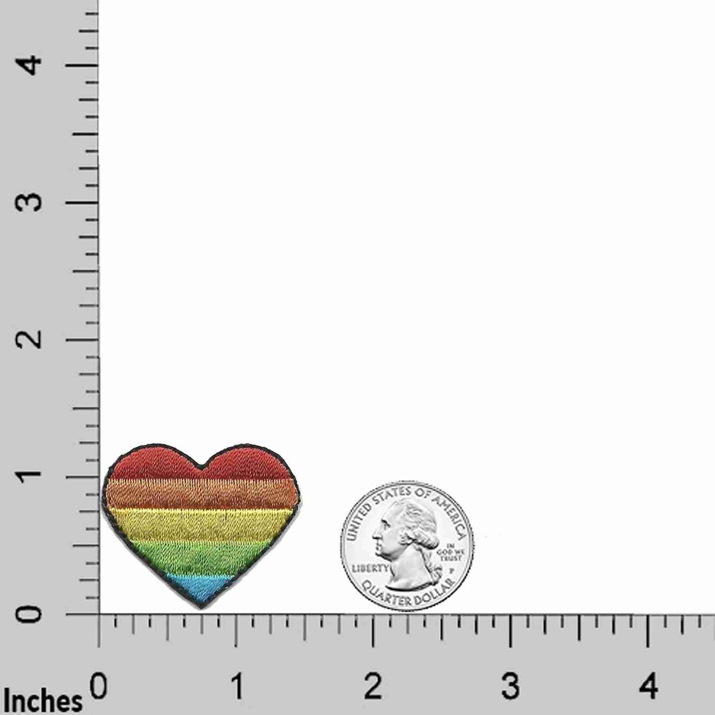 A Rainbow Heart Patches (5-Pack) Heart Embroidered Iron On Patch Applique with a ruler next to it.