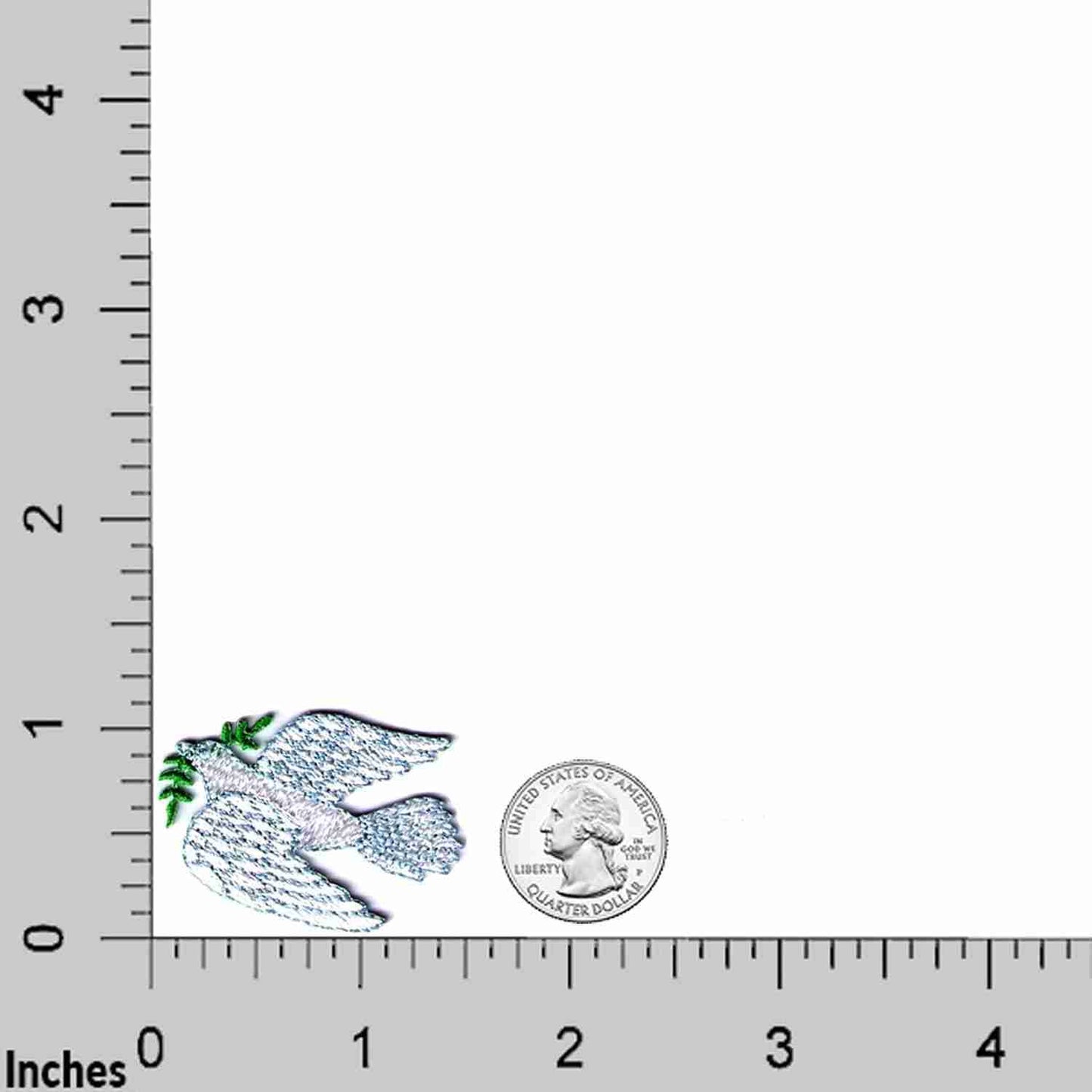 A white Dove of Peace Religious Iron On Patch (5 Pack) with a green leaf on a ruler.