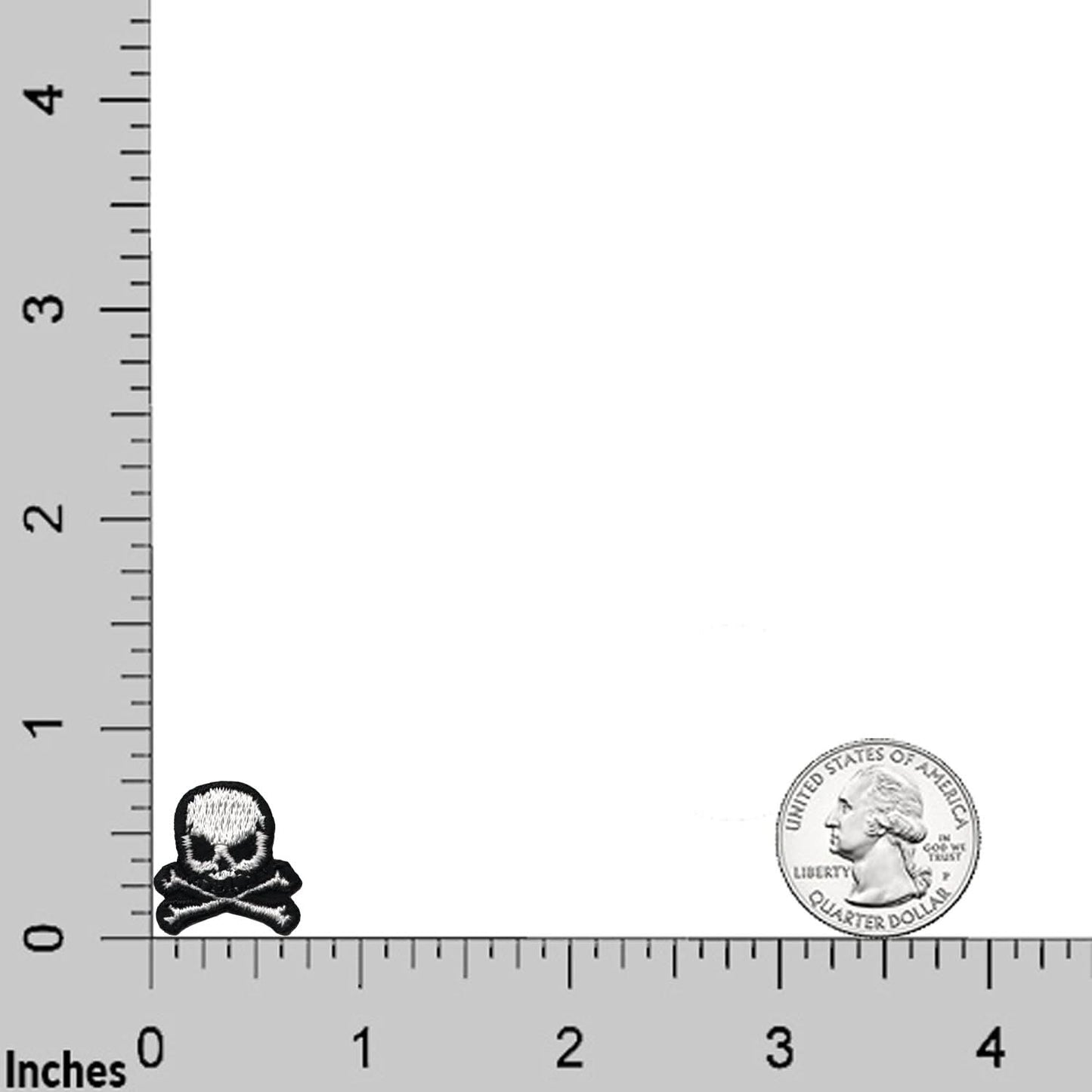 The Laughing Lizards Extra Small Skull (10 Pack) Halloween Embroidered Iron On Patch is shown next to a US quarter on a ruler grid with inch markings, highlighting its size—ideal for DIY craft projects.