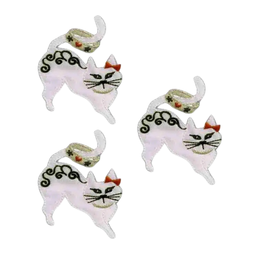The Laughing Lizards Satin Small Cat with Tail Ring Iron On Patch 3-Pack features white cats with black faces, red ears, curled tails, and body patterns—perfect appliques for DIY crafts.