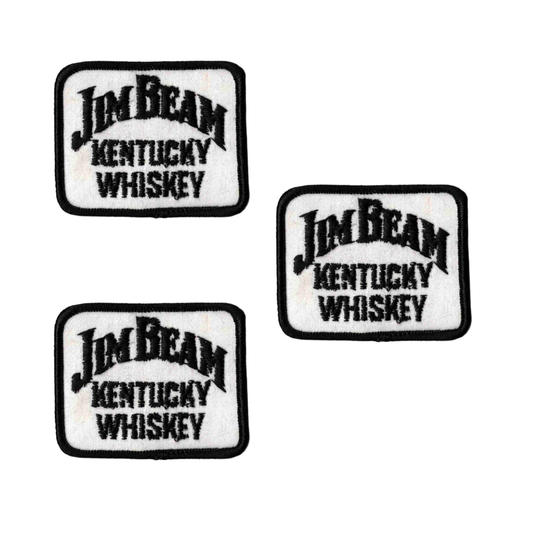 The Laughing Lizards Jim Beam Kentucky Whiskey (3-Pack) Iron on Patch features three rectangular patches with "Jim Beam Kentucky Whiskey" embroidered in black on a white background, each with a black border.