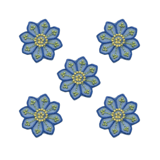 The Laughing Lizards Small Blue Chiffon Daisy Floral Iron On Patches (5-Pack) feature green and yellow accents, perfect as appliques or patches for your crafts.