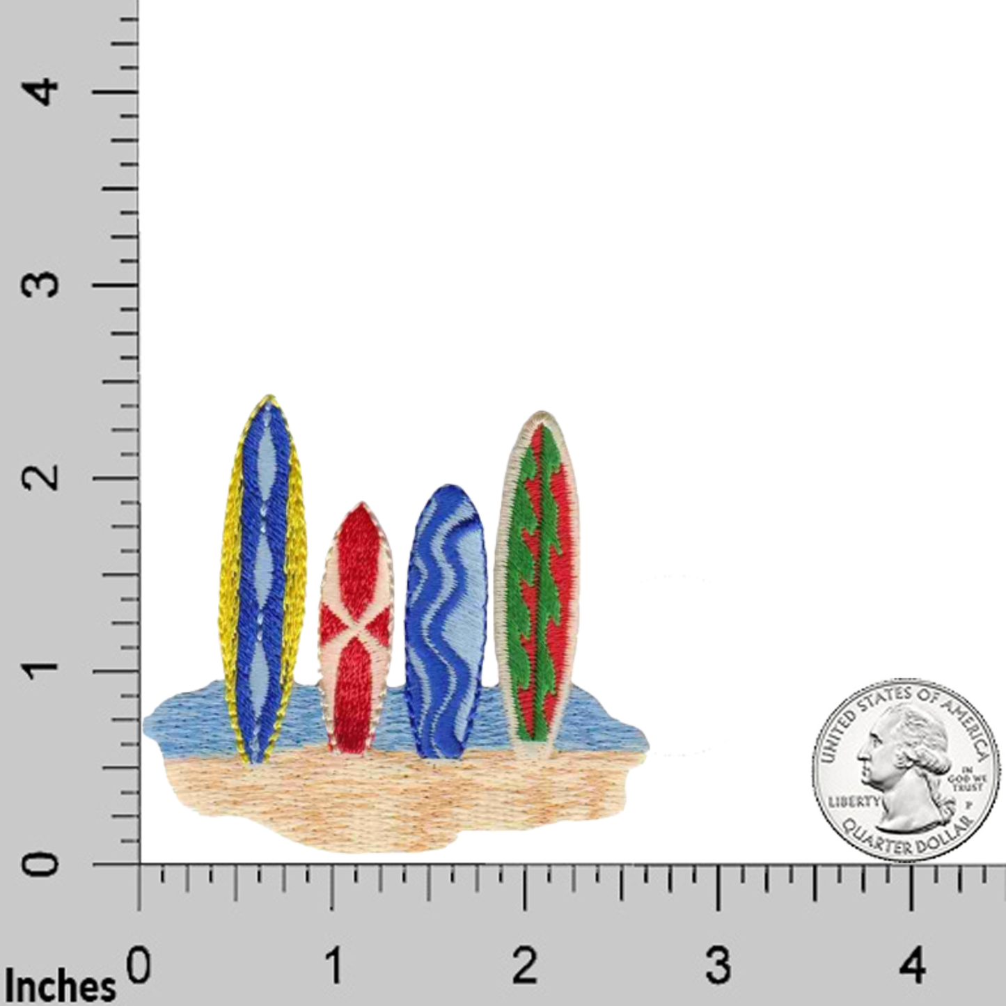 Four vibrant surfboards stand upright on sand beside a ruler and a U.S. quarter, highlighting the colorful design of the Surfboards in Sand (2-Pack) Iron On Patch by Laughing Lizards.