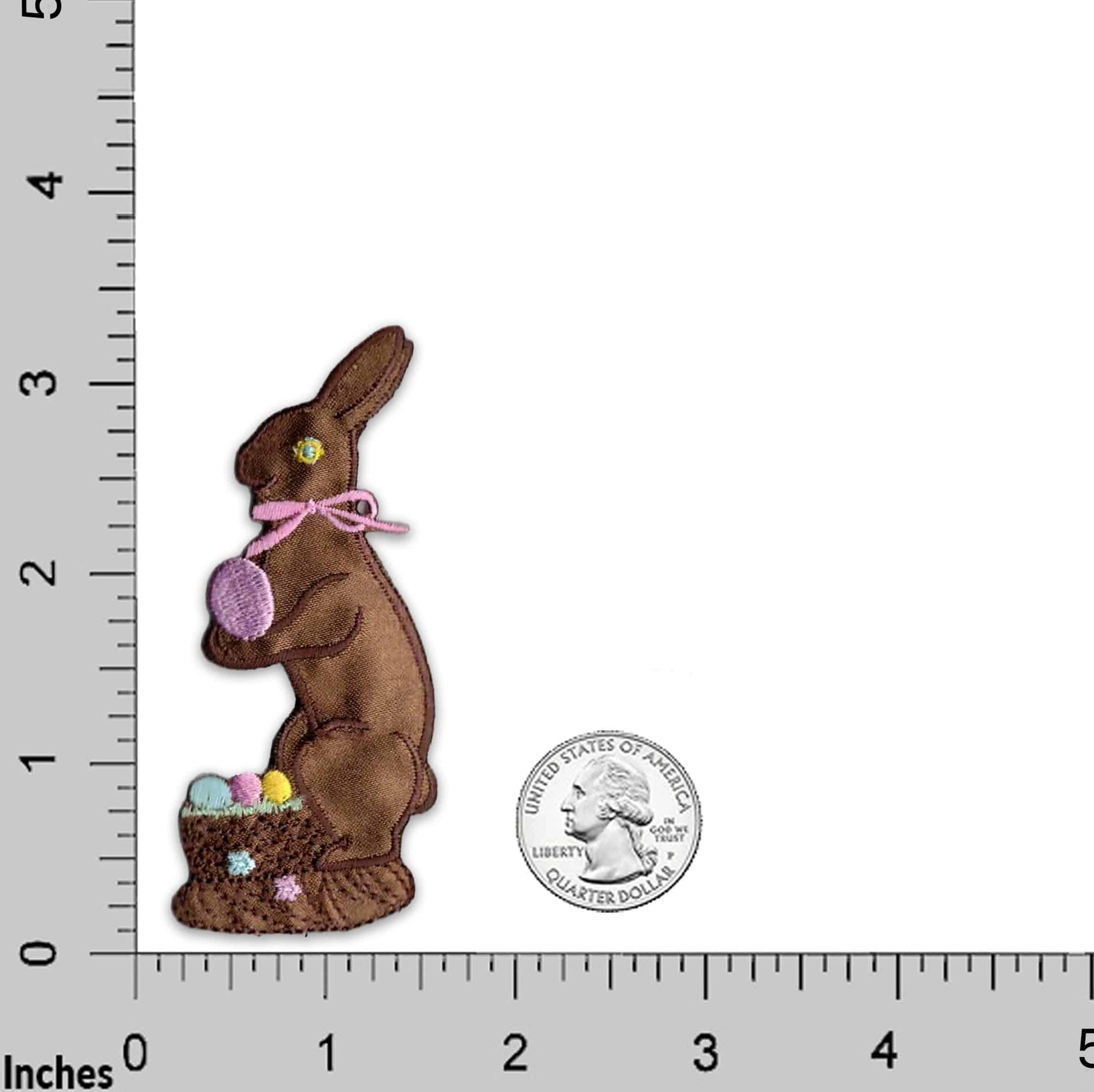 A Curious Zebra in Grass Embroidered Iron On Patch with eggs in a basket next to a ruler.