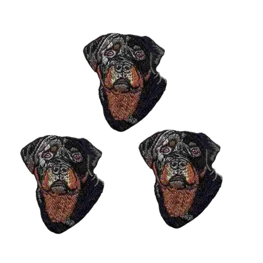 The Laughing Lizards Rottweiler Dog Head (3-Pack) Iron On Patch features three embroidered Rottweiler face patches, arranged on a white background—ideal for decorating clothing, bags, and more.