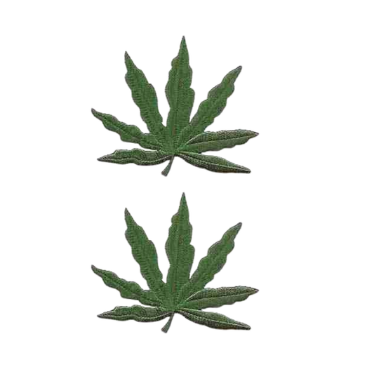 The Laughing Lizards Pot Leaf (2-Pack) Iron on Patch features two green marijuana leaf patches, ideal for DIY crafts or personalizing your gear. Displayed vertically on a plain white background.