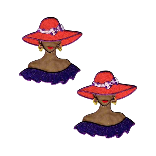 The Laughing Lizards Tan Red Hat Lady with Purple Shoulder Flounce Iron On Patch (2-Pack) features velour embroidered ladies in red hats and purple tops—a stylish patch set for any collection.