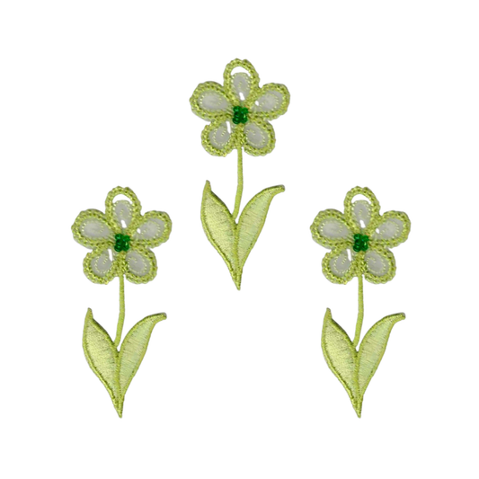 The LaughingLizards Green Flower (3-Pack) Iron on Patch features three embroidered green and white six-petal flowers with two leaves each on a white background, ideal for decorating your jacket or bag.