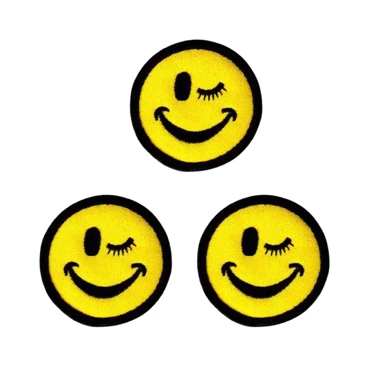 The Laughing Lizards Winking Smiley Face (3-Pack) Iron On Patch features three cheerful yellow patches, arranged in a triangle, perfect for adding playful charm to your favorite gear.