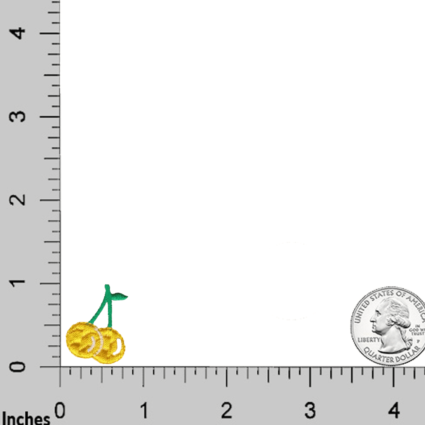 Five small yellow pastel cherry iron-on patches by Laughing Lizards are shown beside a U.S. quarter for scale, with rulers along the edges in inches.