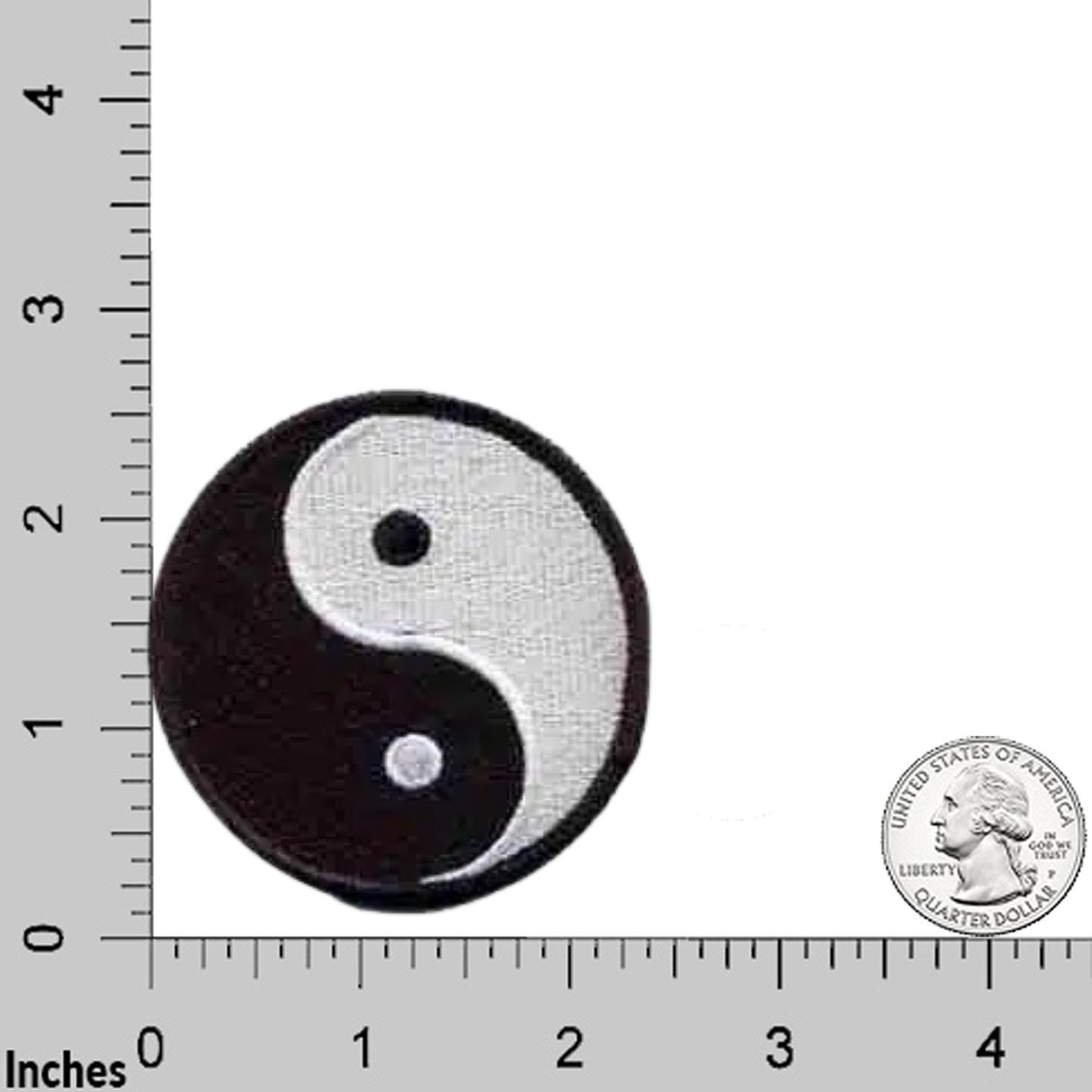 The LaughingLizards Yin Yang Black and White (3-Pack) Iron On Patch is shown beside a U.S. quarter and ruler in inches for scale, highlighting its classic Chinese symbol design.