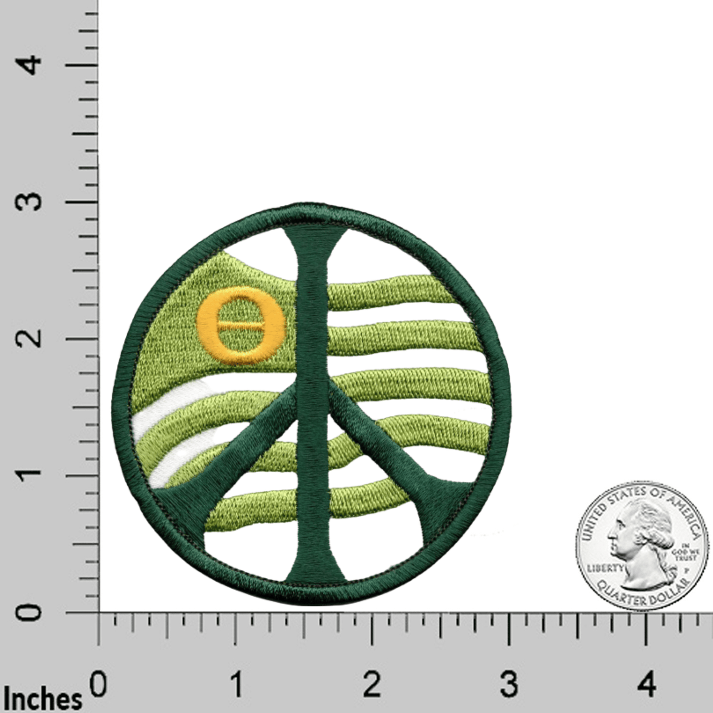 Laughing Lizards Ecology Peace Sign Iron On Patch (2-Pack): Circular embroidered patch with green and yellow stripes and a peace symbol, shown next to a ruler and US quarter for size—a unique addition to your collection.