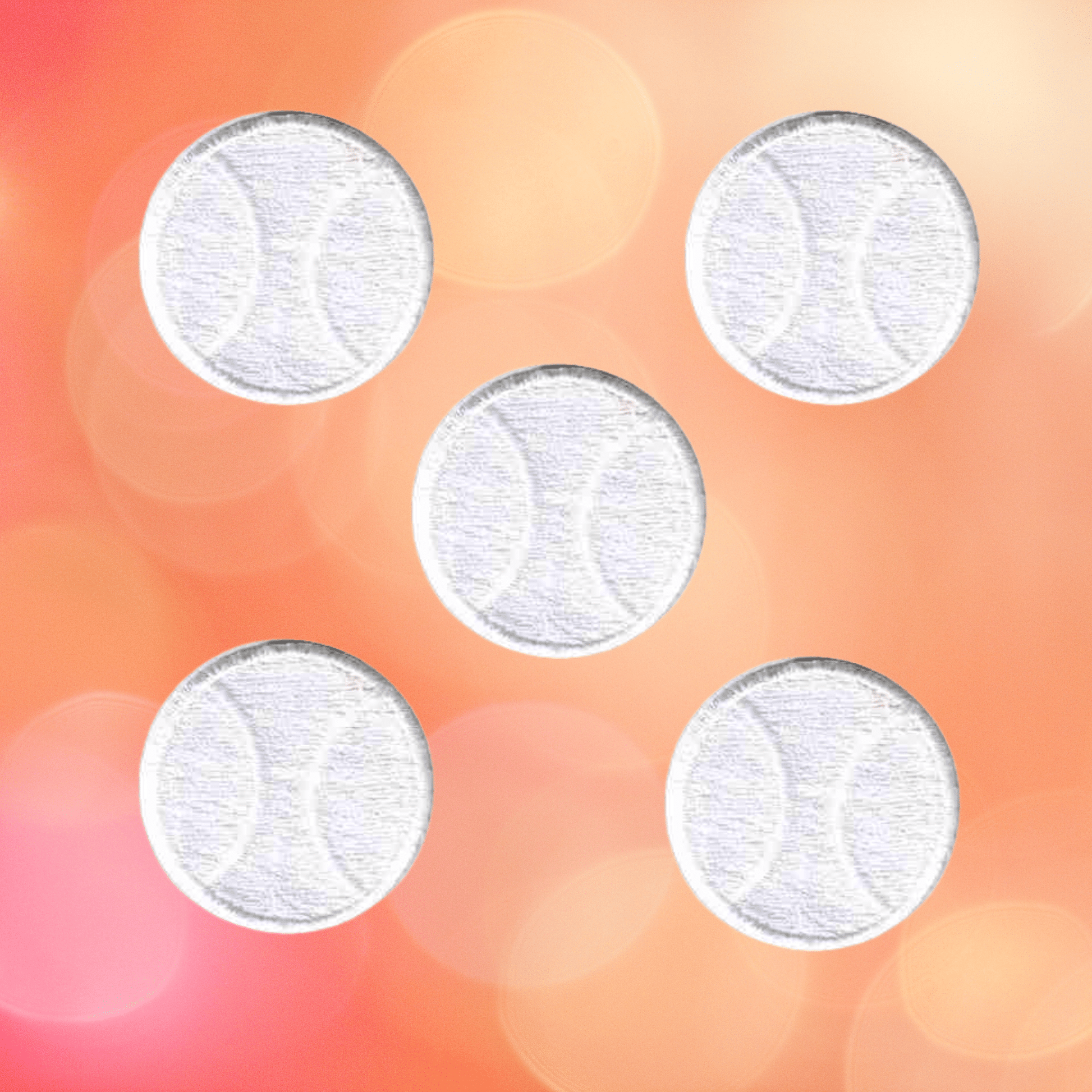 Five white tennis balls from Laughing Lizards' White Tennis Ball (5-Pack) Sports Iron On Patch are evenly arranged in an X shape on a blurred orange-pink background with circular light spots.