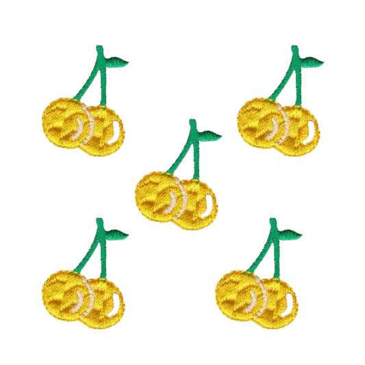 The Laughing Lizards Small Yellow Pastel Cherries Fruit Iron On Patch 5-Pack features pastel yellow cherries with green stems, arranged on a white background—perfect for customizing your projects.
