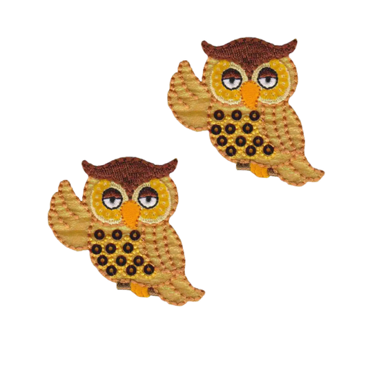 The Laughing Lizards Shimmering Owl with Sequins (2-Pack) Iron on Patch features two sparkling embroidered owl patches, perfect for adding charm to jackets or bags. Displayed on a white background.