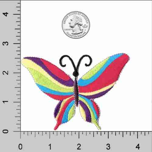 A 60's Multi-Colored Butterfly (3-Pack) Iron On Patch embroidered on a ruler.