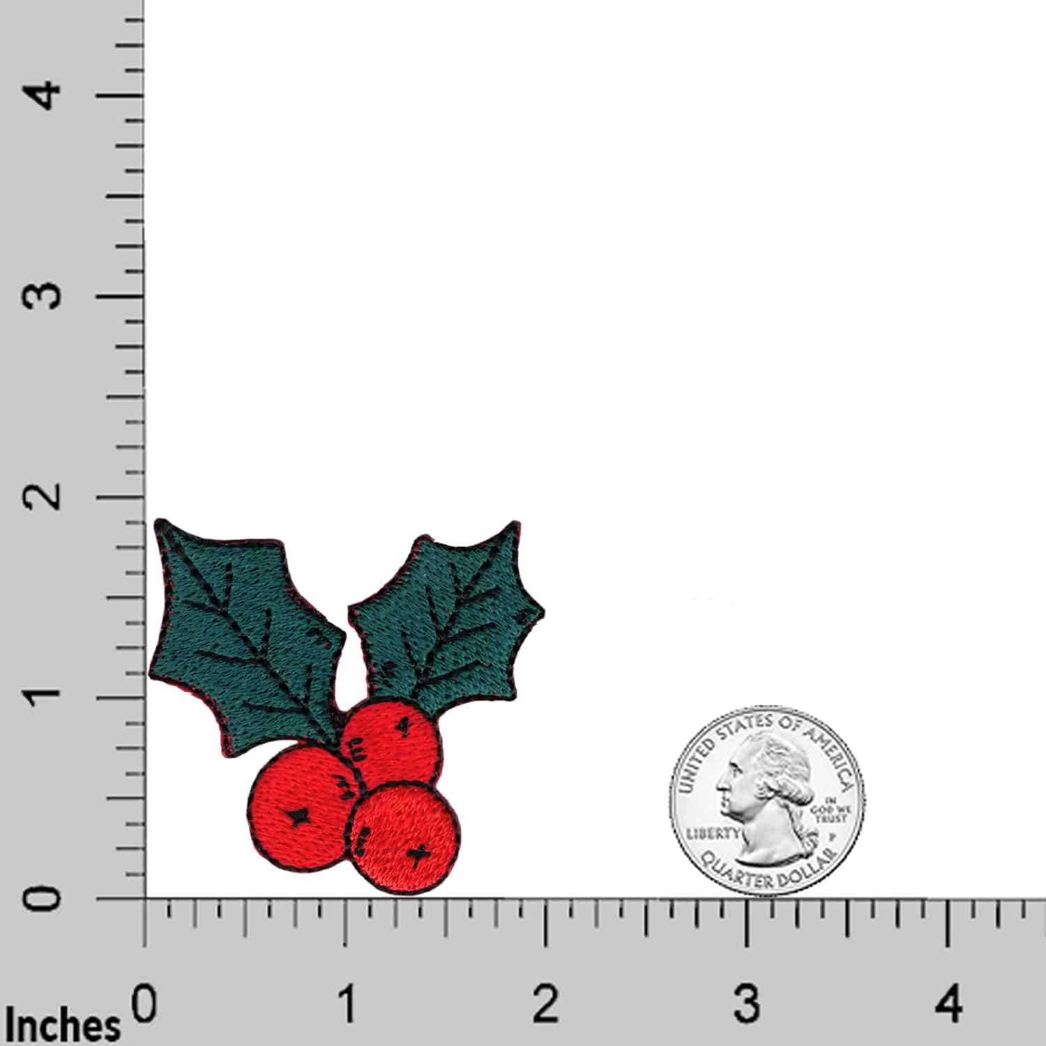 The Laughing Lizards Christmas Holly (3 Pack) embroidered iron-on patch applique is shown next to a U.S. quarter on an inch-marked ruler for size comparison.
