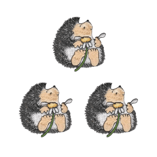 The Laughing Lizards “Cute Hedgehog with Daisy” Iron On Patch 3 Pack features adorable hedgehogs with daisies, perfect for adding charm to your jacket or bag.