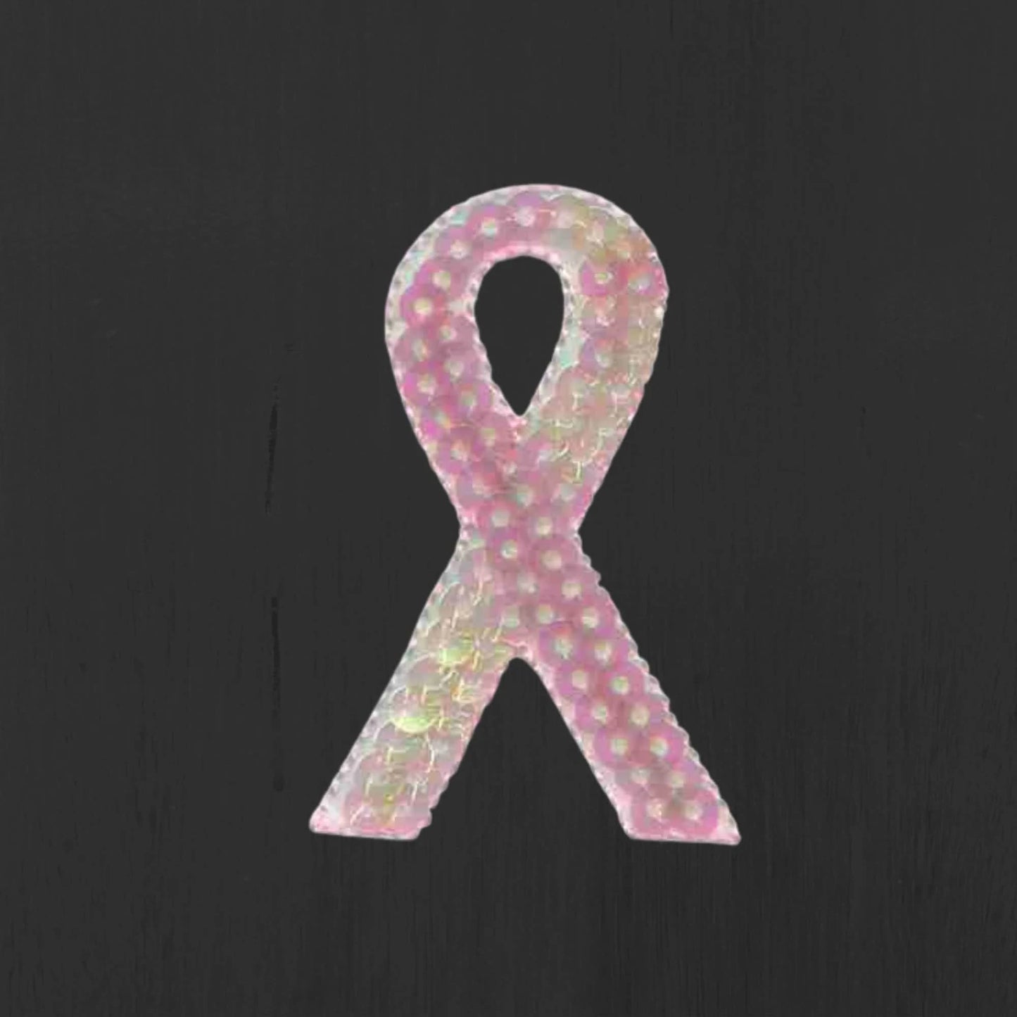 Laughing Lizards Breast Cancer Patches (5-Pack) feature sequined pink awareness ribbon iron-on appliques, ideal for showcasing support. Displayed on a dark background, they're perfect for customizing clothes or accessories.
