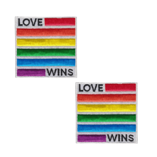 Show your pride with Laughing Lizards' Love Wins Equality (2-Pack) Iron On Patch—featuring square rainbow-striped patches with "LOVE WINS" in black text. A perfect accessory to celebrate love and equality!.