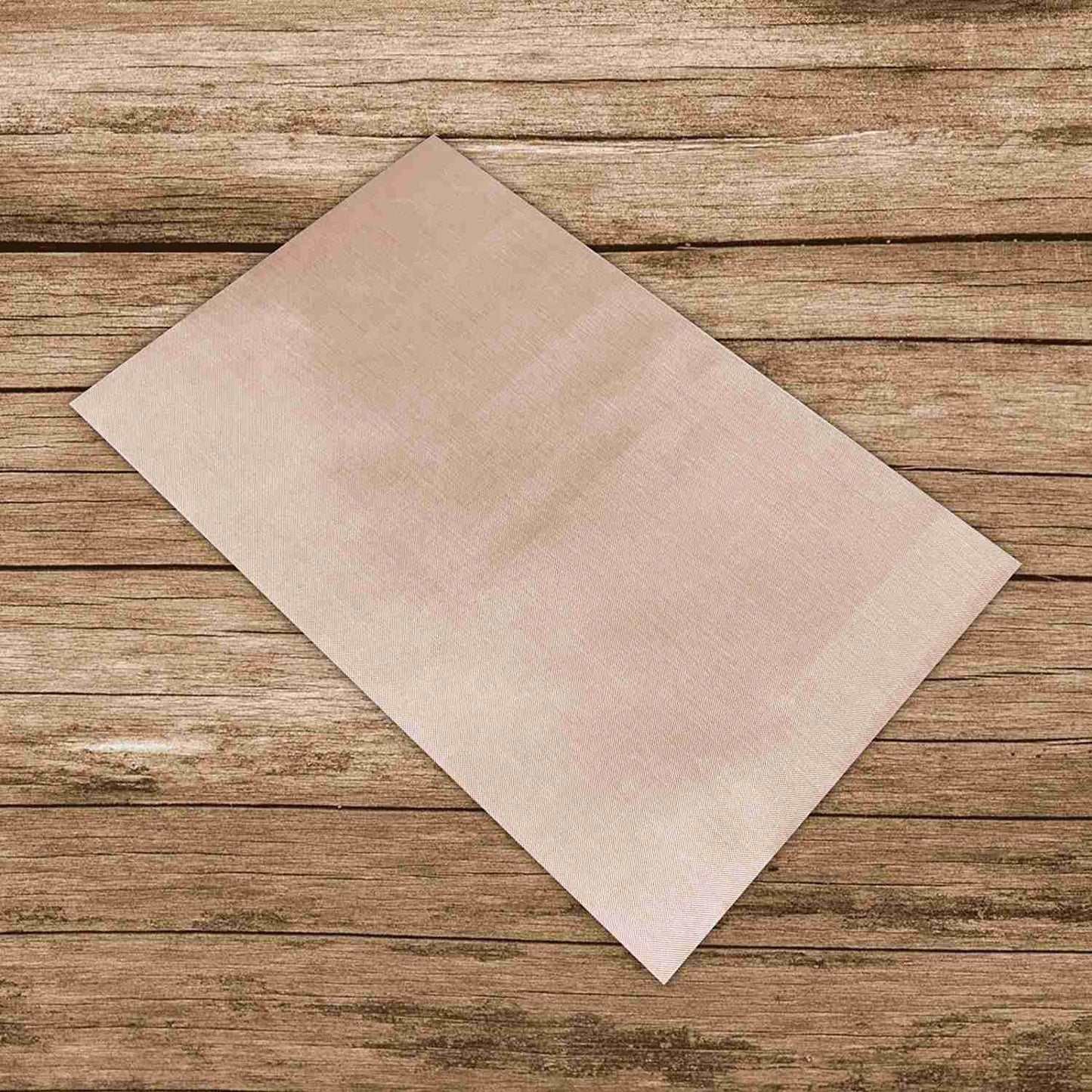 A Patch Pressing Sheet on a wooden surface.