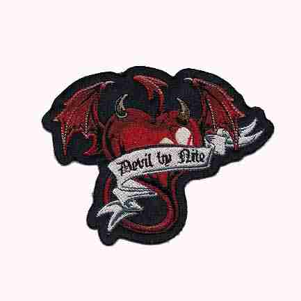 A Devil By Nite Winged Heart Iron On Patch with a dragon and a heart on it.