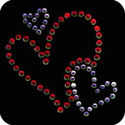 A Trio of Floating Hearts Iron On Rhinestone Applique made of crystals on a black background.