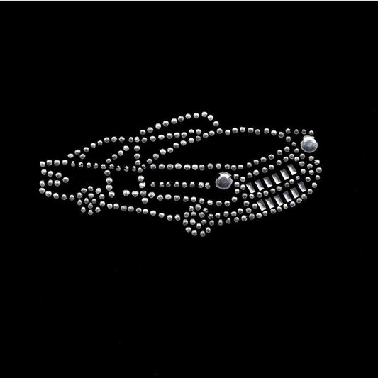 A silver Rhinestones Cadillac Iron on Applique in Clear Stones and Silver Studs car brooch on a black background.