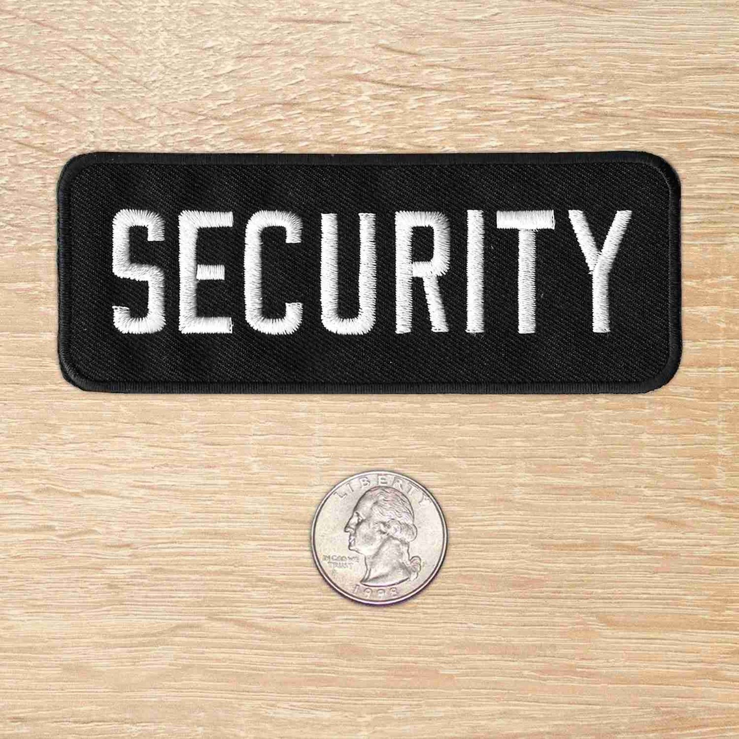 A security patch (2-Pack) with a dime next to it.