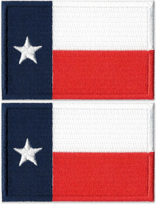 Two Texas State Flag Patch (2-Pack) Texas State Flag Embroidered Iron On Patch Applique feature the Texas state flag, each with a white horizontal stripe on top, a red stripe below, and a vertical blue stripe on the left containing a single white star.