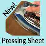 A hand uses an iron on a brown pressing sheet, with the words "New! Pressing Sheet" displayed on a light blue background.