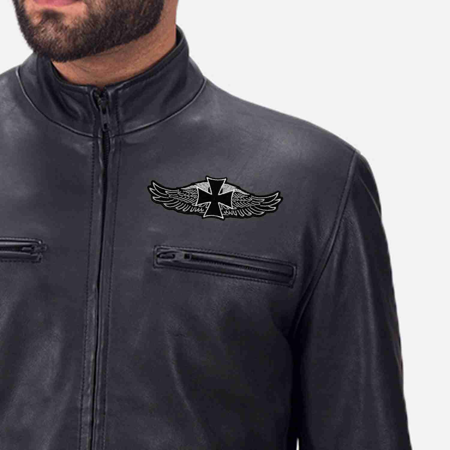 A man wearing a black leather jacket with the Gothic Cross on Harley Wings Biker Iron On Patch on it.