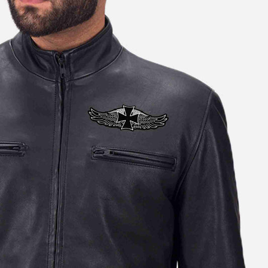 A man wearing a black leather jacket with the Gothic Cross on Harley Wings Biker Iron On Patch on it.