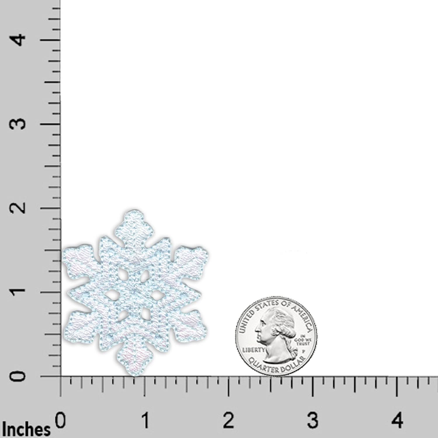 The Laughing Lizards Blue Snowflake Patches (4-Pack) are shown with a U.S. quarter on an inch grid for scale—ideal Christmas embroidered iron-on appliques.