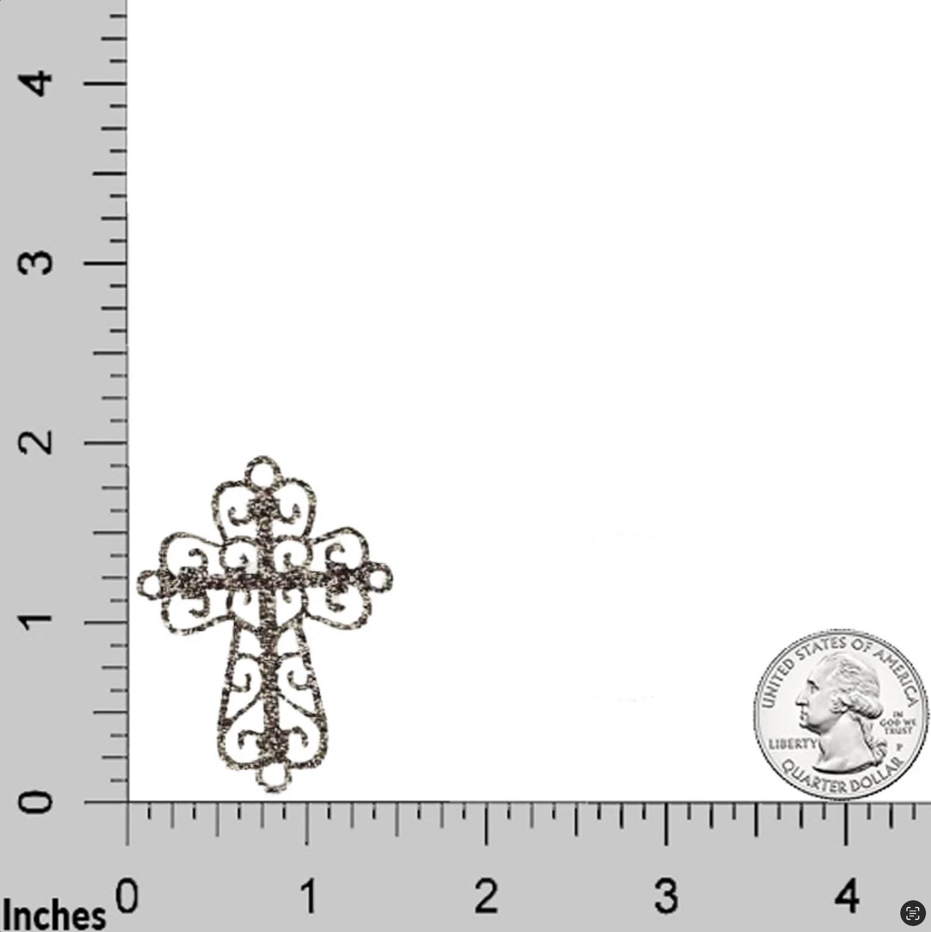 A Silver Cross Patch from the 5-Pack Religious Embroidered Iron On Applique set is shown next to a U.S. quarter on a grid with inch markings for size reference.