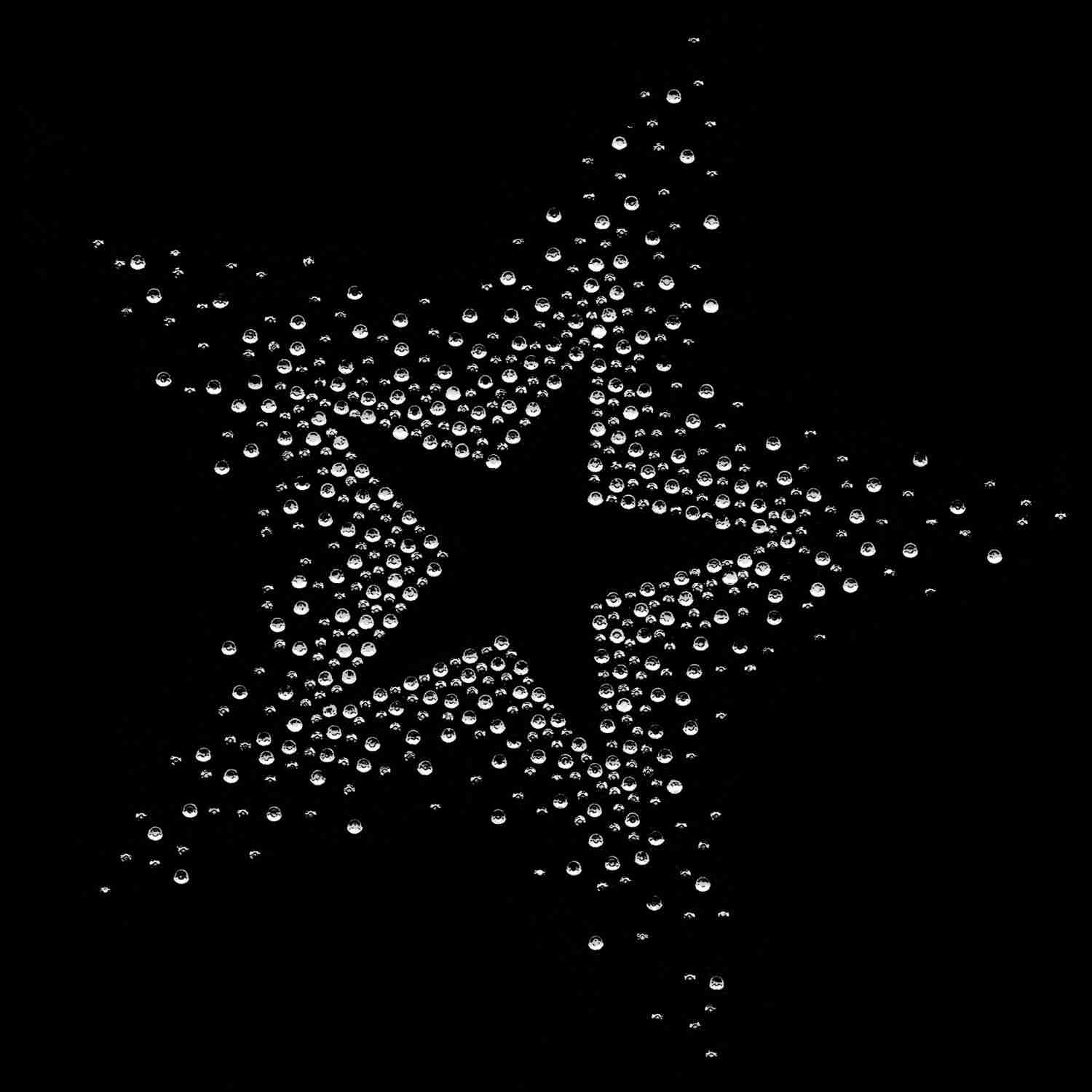 A Large 7.5" Rhinestone Starburst Iron On Applique: Multiple Colors made of dots on a black background.