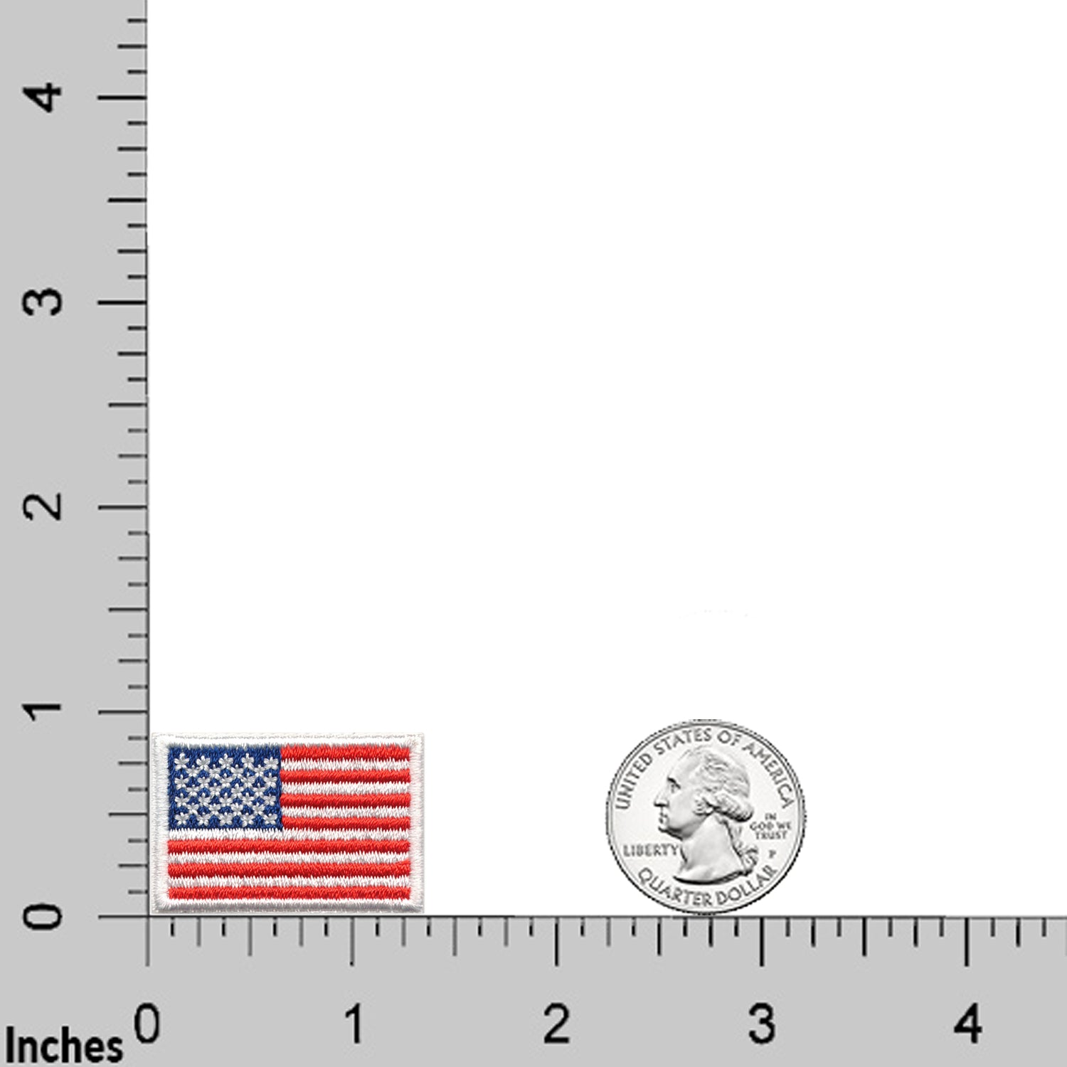 A Laughing Lizards Small American Flag Patch (1"x1.5") from the 10-Pack is shown next to a U.S. quarter on an inch-marked grid, emphasizing its compact size and the detailed embroidery of this patriotic iron-on patch.