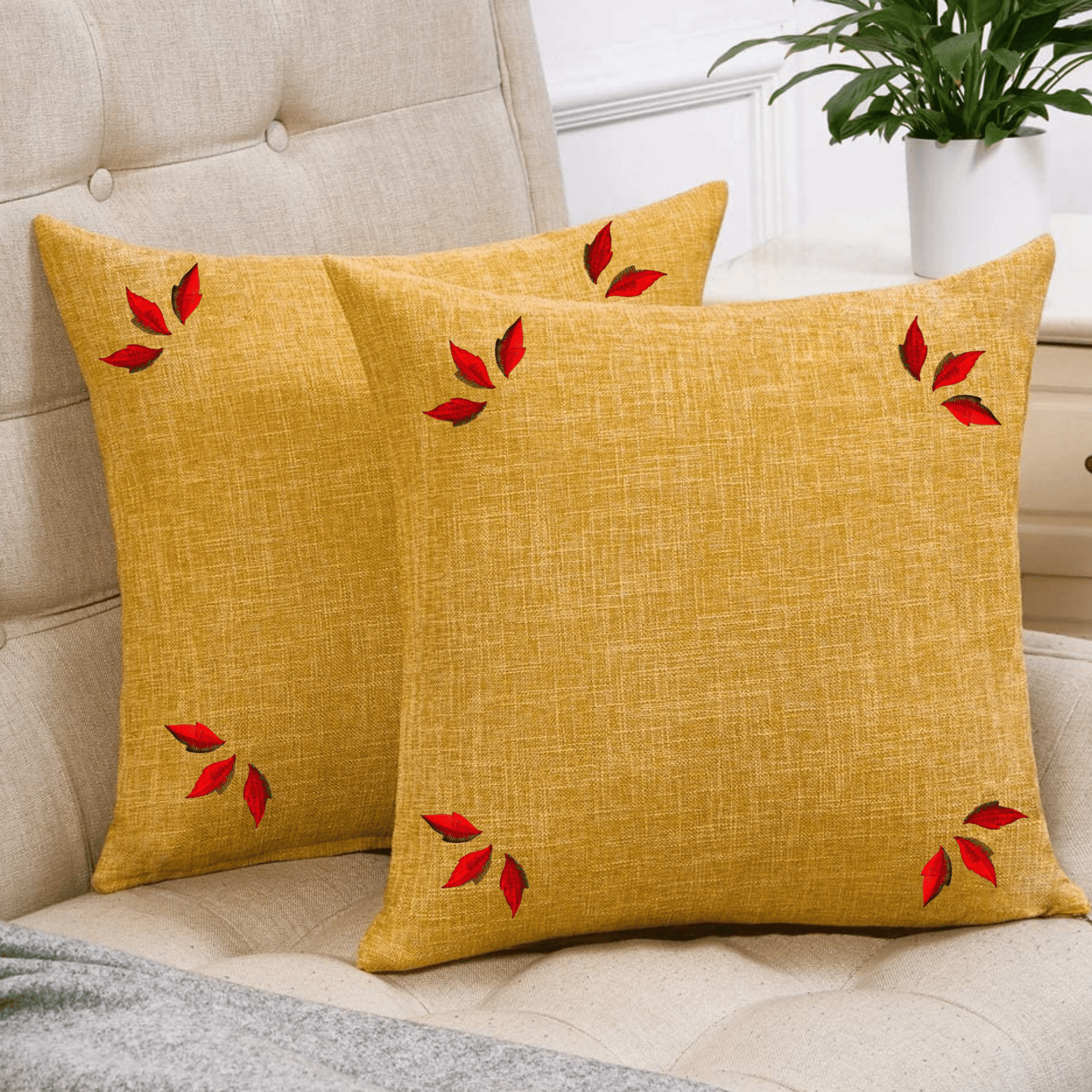 Two yellow Fall Leaf Patches (10 Pack) Fall Embroidered Iron On Patch- Small with red leaves on them.