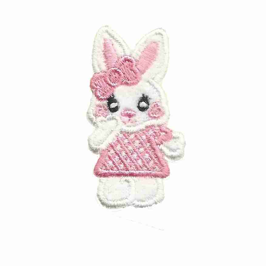 A Bunny Patches (4-Pack) Easter Embroidered Iron on Patch Appliques in a pink dress embroidered on a white background.