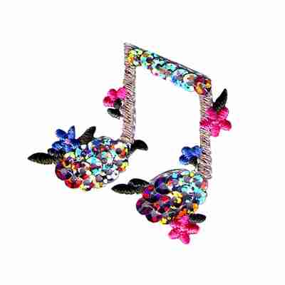 A Silver Sequin Double Eighth Notes Iron On Music Patch with flowers on it.