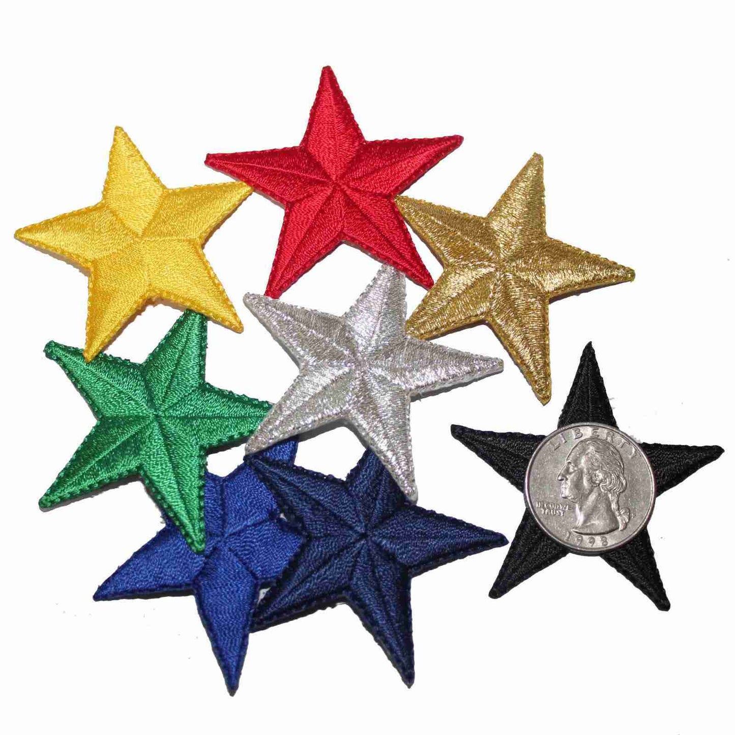 A group of 2 Inch Star Iron on Patch (5 Pack) patches with a coin.
