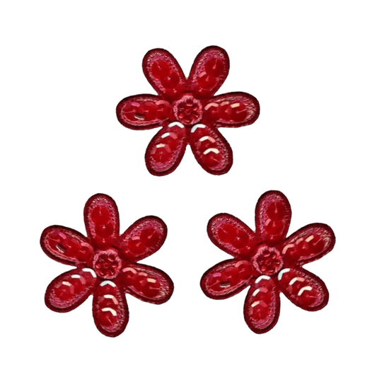 Add vibrant flair to DIY projects with Laughing Lizards' Sequin Daisy (3-Pack) Iron On Floral Patch—three red, six-petaled daisies in a triangle on white, perfect for crafts or as standout floral accents.