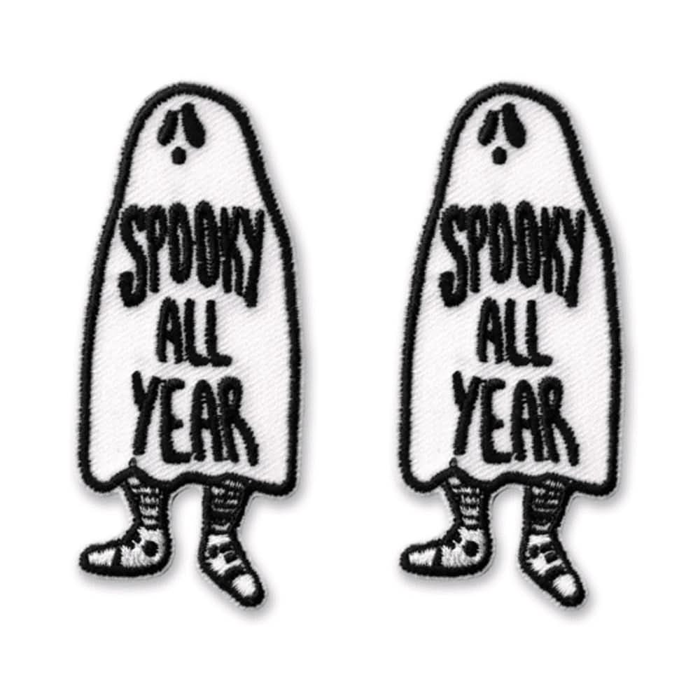 The Laughing Lizards Spooky All Year Iron On Patch Embroidered Applique features two ghost-shaped patches with striped legs and surprised faces—fun Halloween decorations for your costume or jacket.