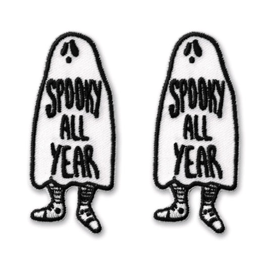 The Laughing Lizards Spooky All Year Iron On Patch Embroidered Applique features two ghost-shaped patches with striped legs and surprised faces—fun Halloween decorations for your costume or jacket.